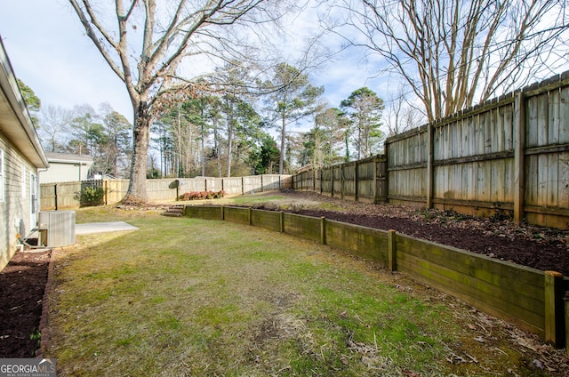 view of yard featuring central air condition unit