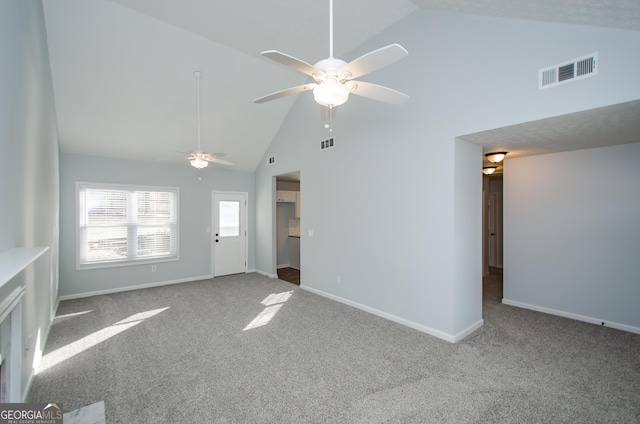 interior space featuring ceiling fan, carpet flooring, and high vaulted ceiling