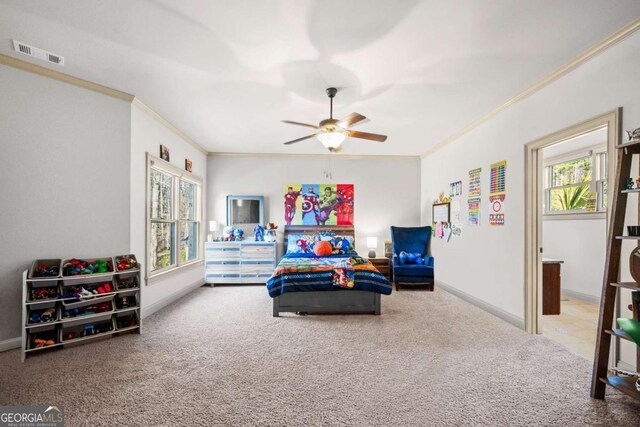 bedroom featuring crown molding, ceiling fan, and carpet