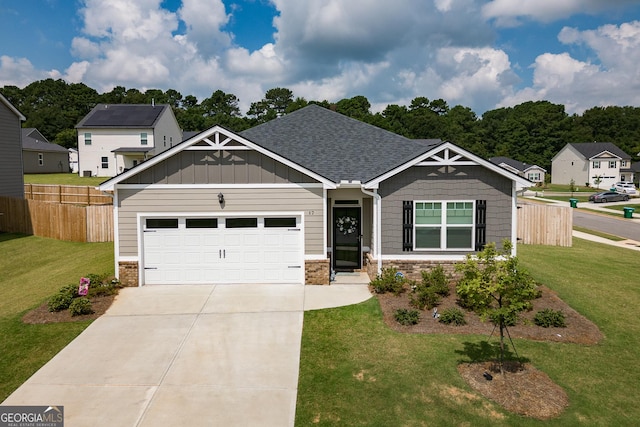 craftsman-style home featuring a garage and a front yard