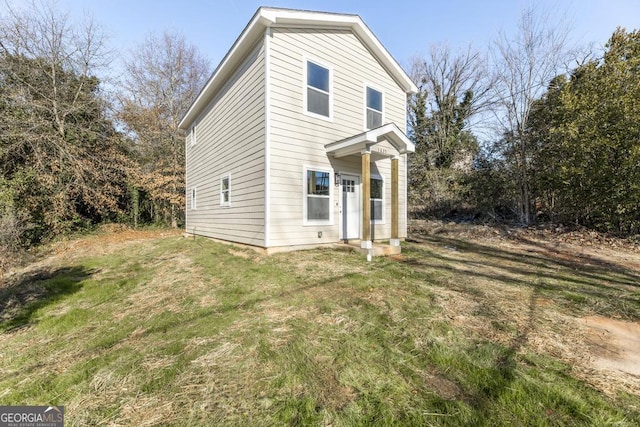 view of front of property with a front lawn