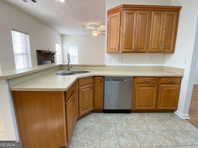 4299 High Country Dr, Douglasville, GA 30135 - kitchen featuring sink, dishwasher, ceiling fan, a textured ceiling, and a stone fireplace