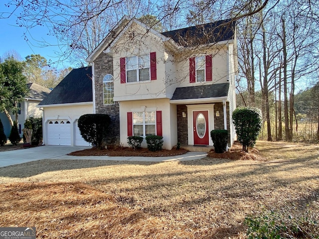 front of property featuring a garage and a front yard