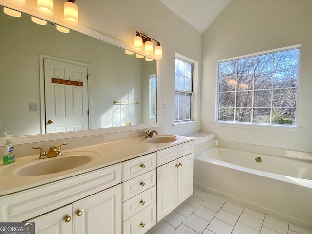 4299 High Country Dr, Douglasville, GA 30135 - bathroom with a bath, vaulted ceiling, tile patterned floors, and plenty of natural light