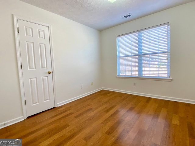 4299 High Country Dr, Douglasville, GA 30135 - unfurnished room with hardwood / wood-style flooring and a textured ceiling