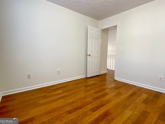 4299 High Country Dr, Douglasville, GA 30135 - empty room with hardwood / wood-style floors and a textured ceiling