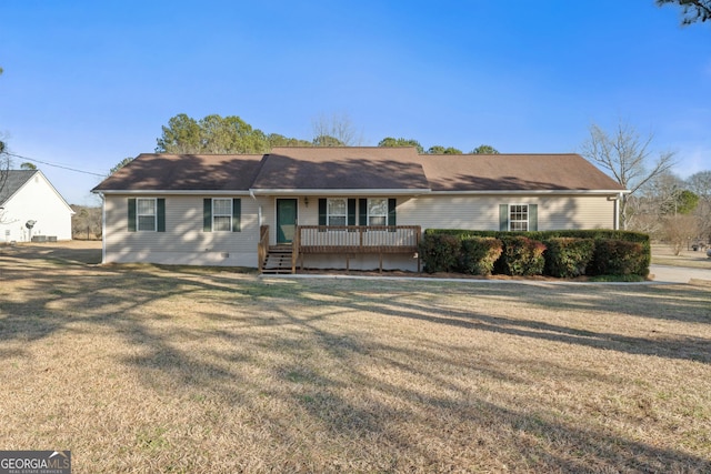 single story home with a wooden deck and a front lawn