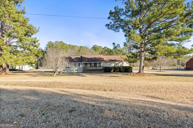 ranch-style house featuring a front lawn