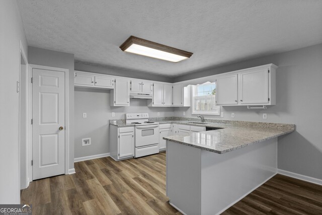 kitchen with hardwood / wood-style flooring, white cabinetry, and electric stove