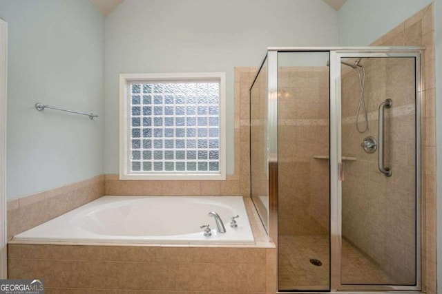 bathroom featuring plus walk in shower