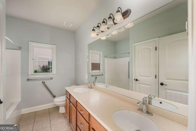 bathroom featuring vanity, toilet, and tile patterned flooring