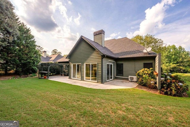 rear view of house with a yard, a pergola, a patio area, and ac unit