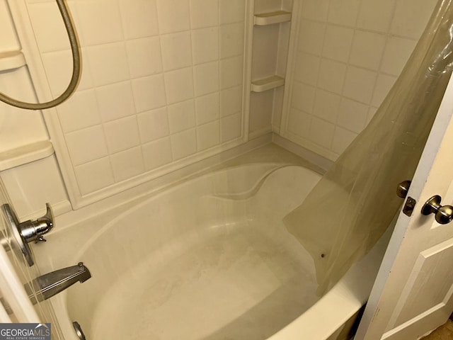 bathroom featuring shower / tub combo with curtain