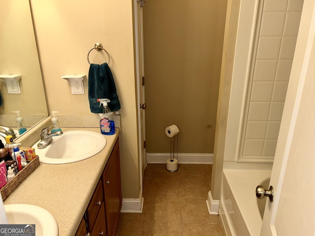 bathroom with tile patterned flooring and vanity