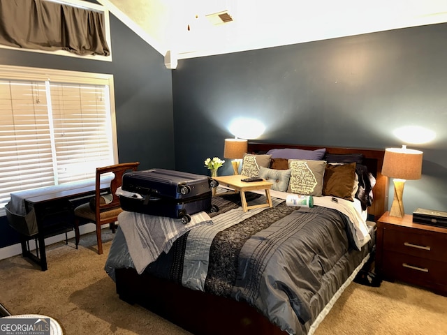 carpeted bedroom featuring lofted ceiling