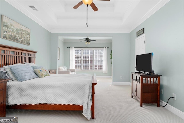 bedroom featuring light carpet, ornamental molding, a raised ceiling, and ceiling fan