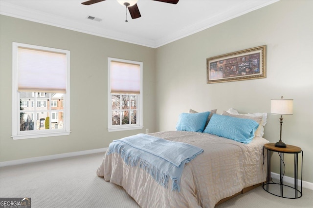 bedroom featuring ornamental molding, ceiling fan, and carpet flooring