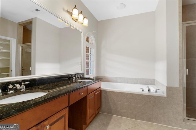 bathroom featuring tile patterned flooring, vanity, and independent shower and bath