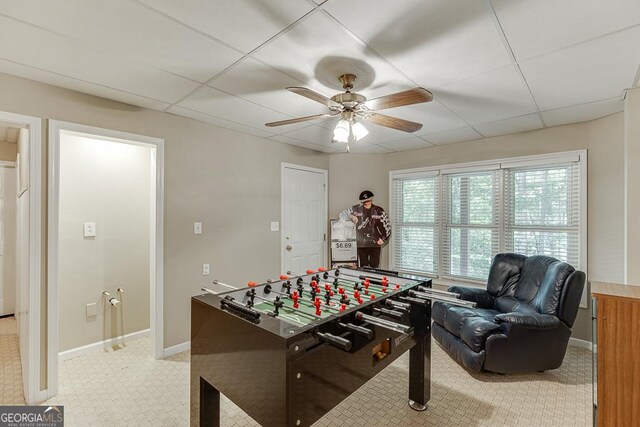 playroom with a drop ceiling and ceiling fan