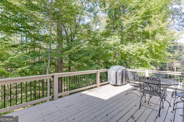 wooden terrace with area for grilling