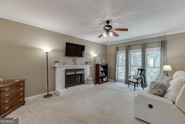 carpeted living room with ceiling fan, ornamental molding, and a brick fireplace