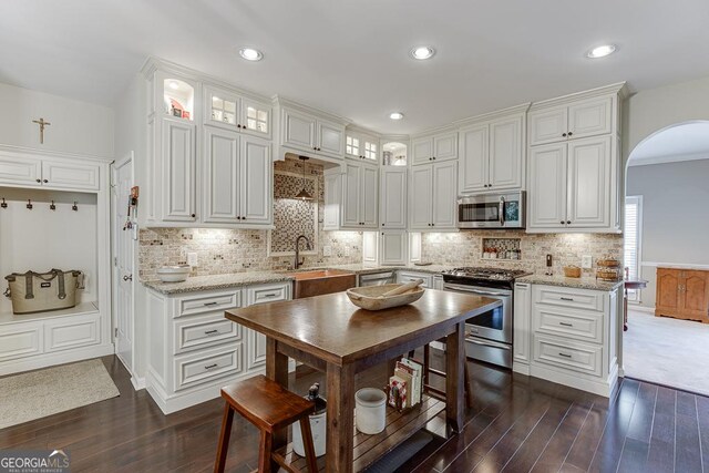 kitchen featuring white cabinetry, sink, and appliances with stainless steel finishes