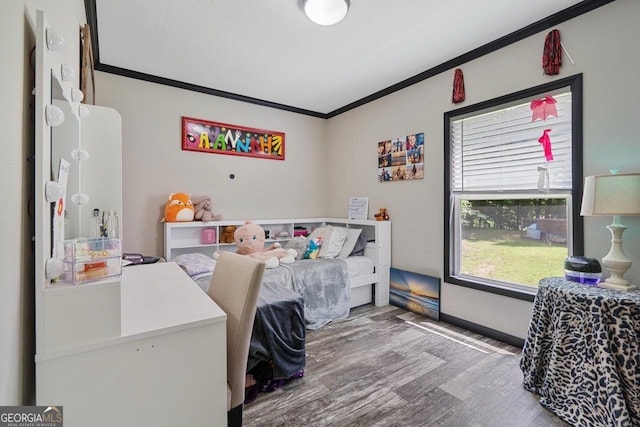 bedroom with crown molding and wood-type flooring