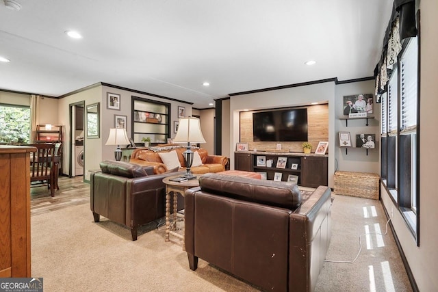 living room featuring ornamental molding and light carpet