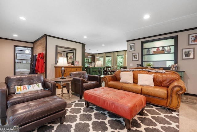 living room with light carpet and ornamental molding