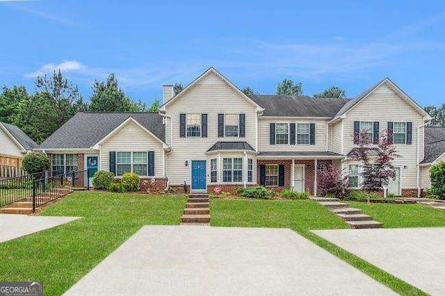 view of front of home with a front lawn