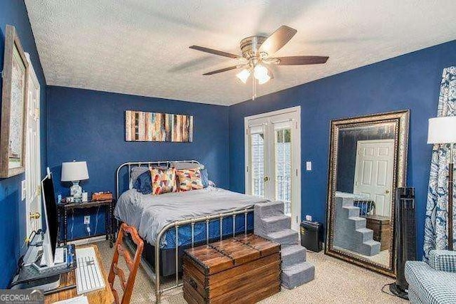 carpeted bedroom featuring french doors, ceiling fan, a textured ceiling, and access to outside