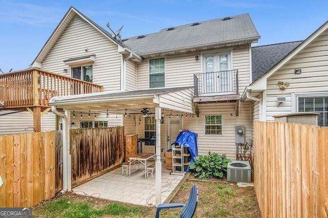 back of house with a patio, a balcony, and cooling unit