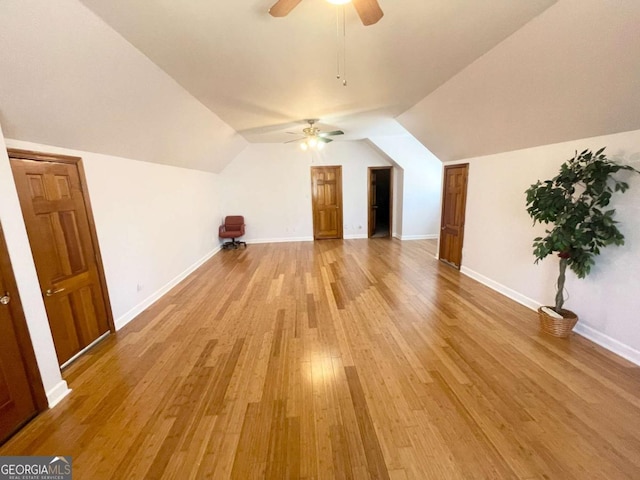 bonus room with ceiling fan, vaulted ceiling, and light wood-type flooring