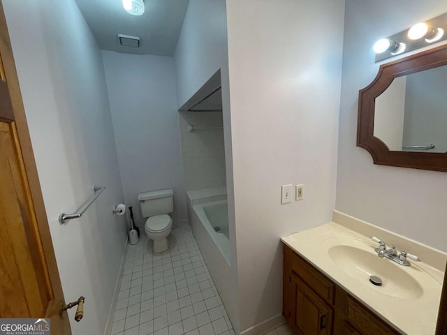 bathroom with vanity, toilet, tile patterned flooring, and a washtub