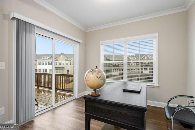 office area with hardwood / wood-style flooring, ornamental molding, and plenty of natural light