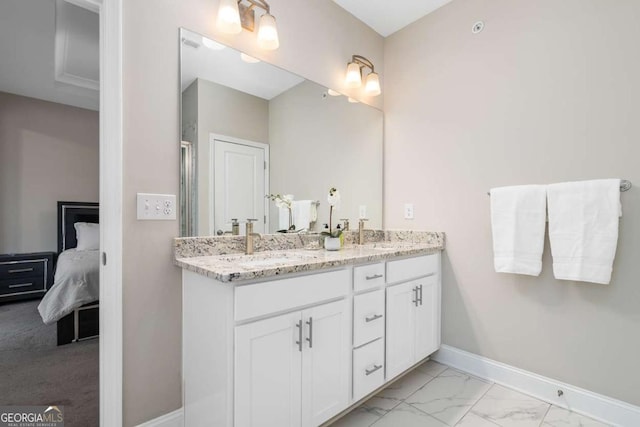 bathroom with vanity and a shower with door