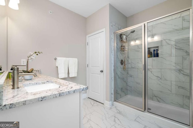 bathroom featuring vanity and a shower with shower door