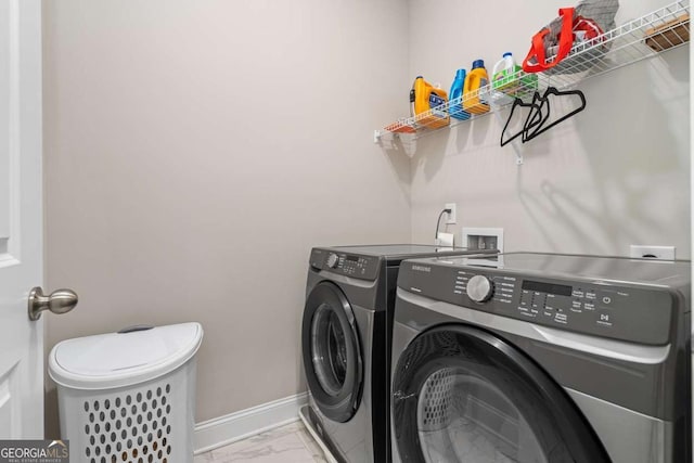 laundry area with washer and dryer