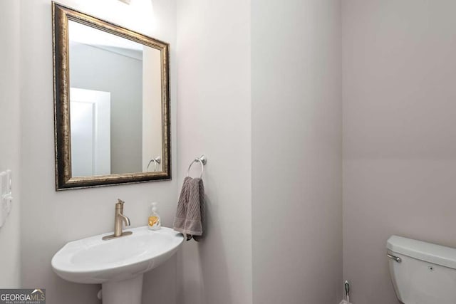 bathroom with sink and toilet