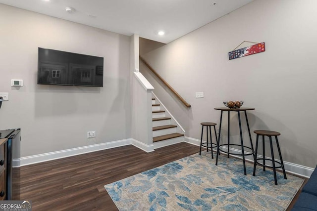 stairway featuring wood-type flooring