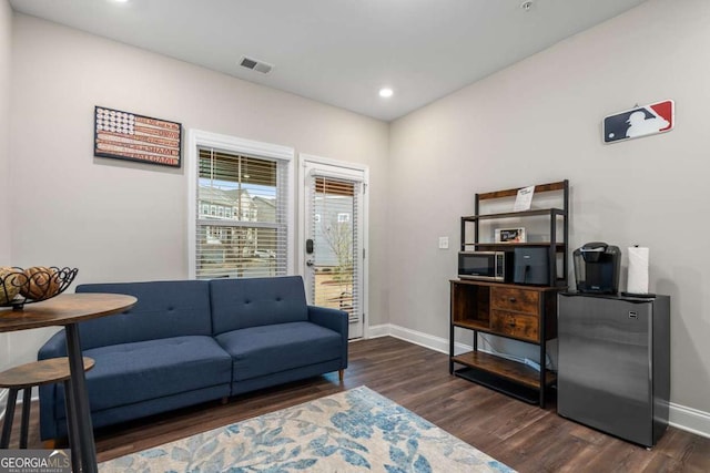 living area featuring dark hardwood / wood-style floors