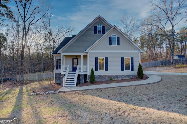 view of front of house featuring a front yard and a porch