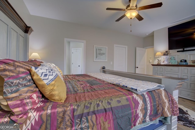 bedroom featuring ceiling fan and light hardwood / wood-style floors