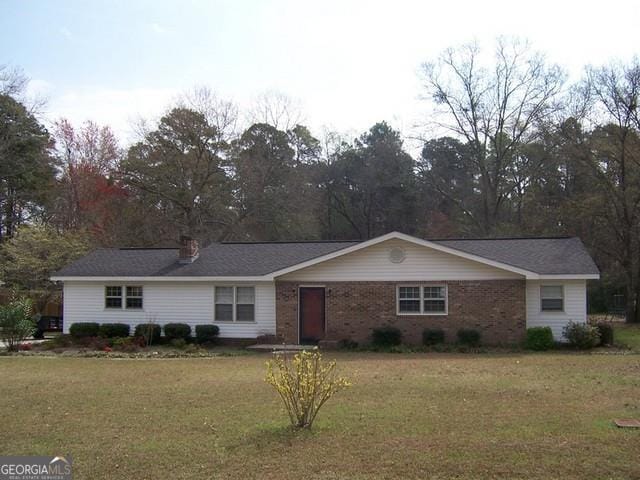 ranch-style house with a front yard