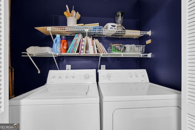 laundry area with separate washer and dryer