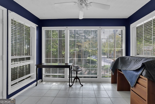 sunroom / solarium with ceiling fan