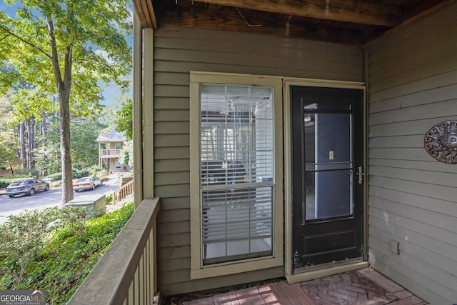 entrance to property featuring a balcony