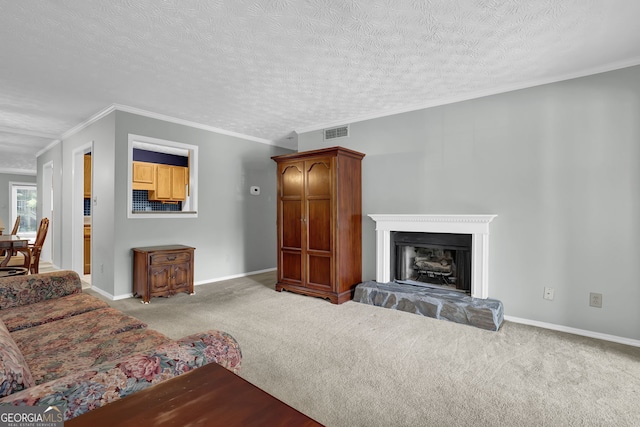 living room with crown molding, light colored carpet, and a textured ceiling