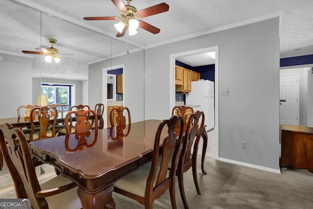 carpeted dining room featuring crown molding