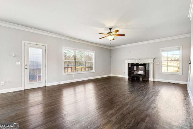 unfurnished living room with crown molding, ceiling fan, and dark hardwood / wood-style floors